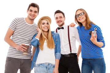 Obraz premium Four stylish young people on white background
