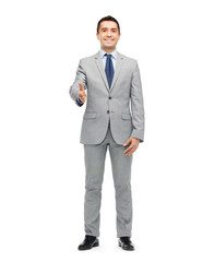 happy smiling businessman in suit shaking hand