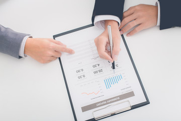 Business people discussing the charts and graphs showing the res