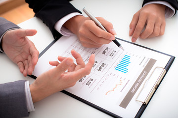 Business people discussing the charts and graphs showing the res