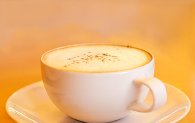 warm color tone style of coffee on paint background, soft focus
