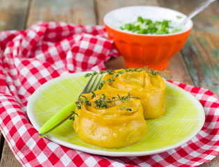Carrot rolls of dough stuffed with meat