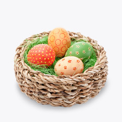 Naklejka na ściany i meble Easter eggs in a basket