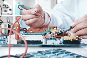 Electronics repair service, closeup on hands