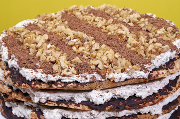 Meringue cake with nuts and chocolate.