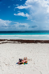 Fototapeta na wymiar Young fashion woman relax on caribbean beach of Tulum, near Play