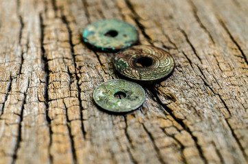 antique coins on wooden background