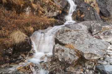 Naklejka na ściany i meble waterfall in the Himalayan slope
