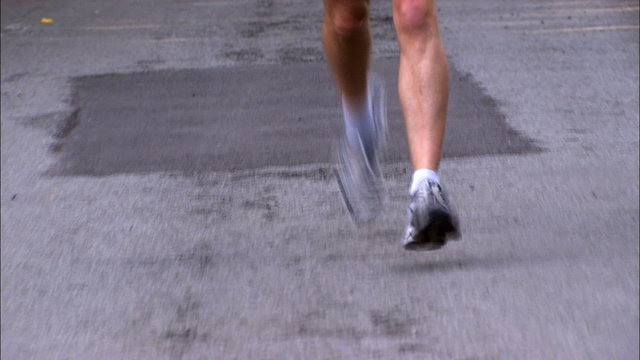 Close up of mans feet running towards camera