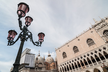 Fototapeta na wymiar Beautiful venetian ornate lampposts with pink murano glass.