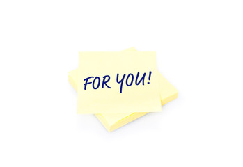 Yellow sticky note with block and text For You on white