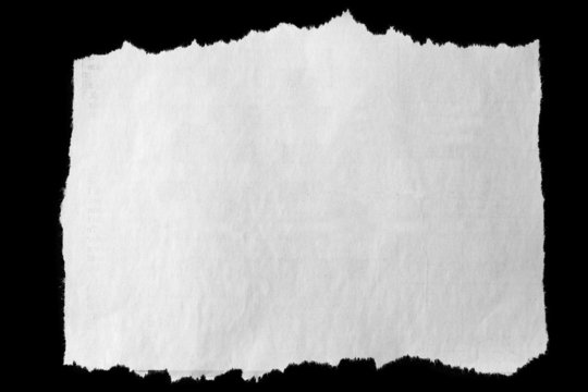 One piece of torn white paper on black