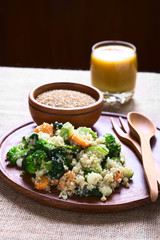 Cooked white quinoa seeds with fried vegetables