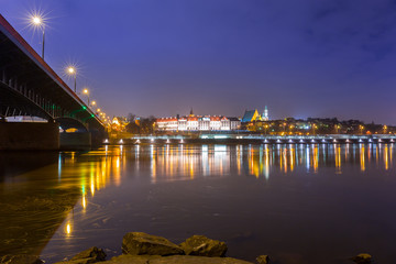 Fototapeta na wymiar Vistula river scenery with bridge and Royal Castle in Warsaw