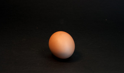 One egg on the black background