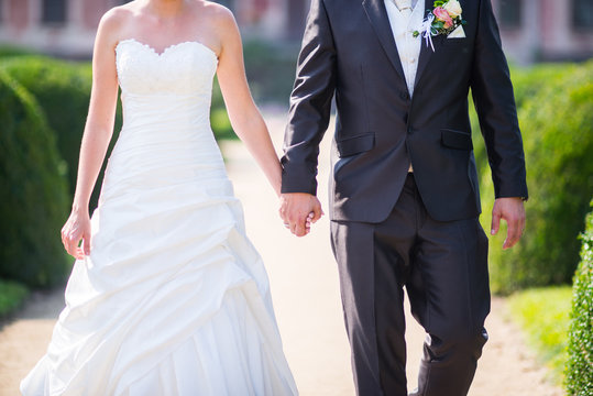 Wedding couple with hands on