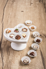 Chocolate truffle on wood, text space