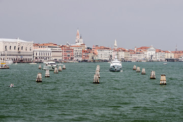 Doges palace and water traffic in summer Venice