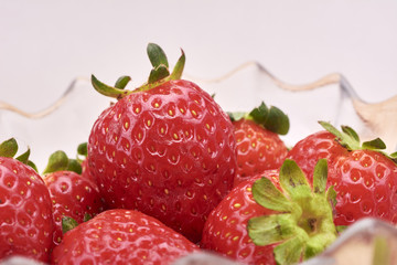 Strawberries red in wood background