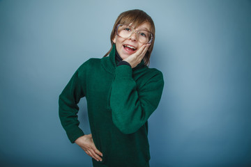 Fototapeta premium teenager boy brown hair European appearance in green sweater ret