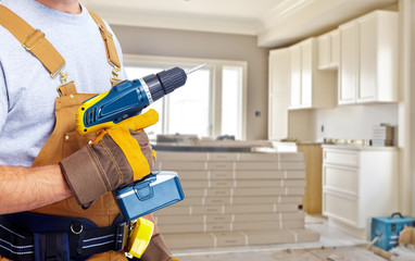 Builder handyman with construction tools.
