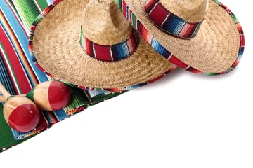 Wall murals Mexico Mexican blanket or rug maracas and sombrero isolated on white background Mexico holiday vacation fiesta photo