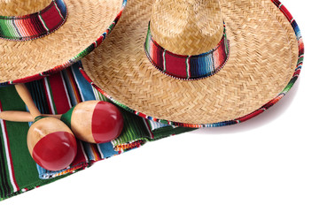 Mexican blanket or rug maracas and sombrero isolated on white background Mexico holiday vacation fiesta photo