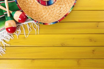 Fotobehang Mexican background with sombrero straw hat maracas and traditional serape rug or blanket on old planked pine wood Mexico holiday vacation cinco de mayo photo  © david_franklin