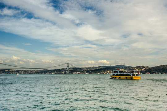 tourist ship visiting Bosphorus Bridge Istanbul Turkey