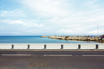 Asphalt road near the port and sea promenade.