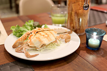Crabs in white dish.
