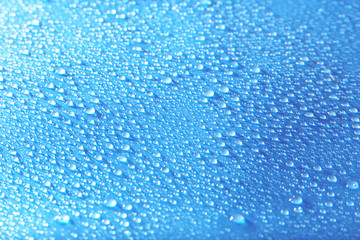 Water drops on light blue background