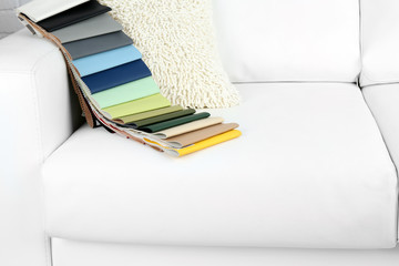 Scraps of colored tissue on sofa close up