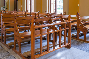 Wood Bench of Catholic church, people can pray for god jesus
