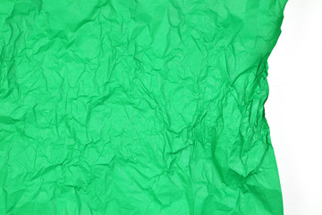 Crumpled green paper with white space