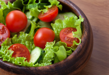 Spring healthy vegetarian salad with tomatoes and cucumber