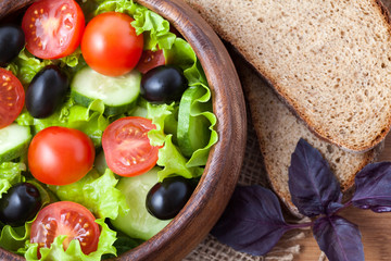 Spring super food vegetarian salad with tomato and olives