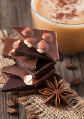 Stack of chocolate with nuts coffe and star anise