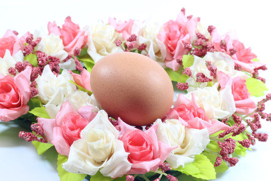 Eggs on a bouquet of flowers.