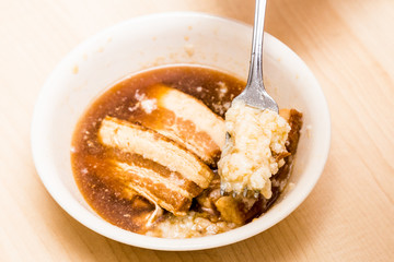 Stew pork slice and solidified fats from canned food