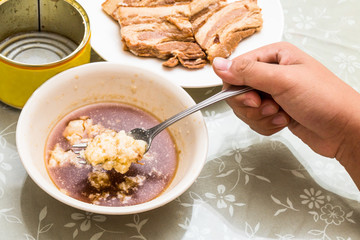 Stewed pork slice and solidified fats from canned food