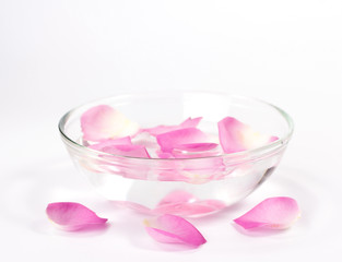 Infused water with rose petals in a reflection bowl