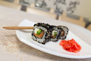  Sushi rolls,wasabi and ginger on  plate