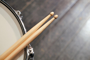 Drum sticks lay on an drum set