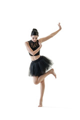 Obraz premium Young attractive ballerina doing alternate dance moves