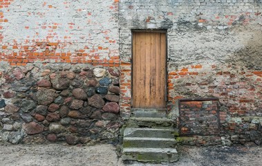 Old house wall with wooden dors