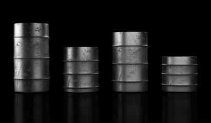 Four oil barrels on dark background