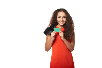 Happy smiling girl showing blank credit card, on white backgroun