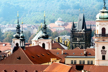 Rooftops and towers of Old Prague on a misty day