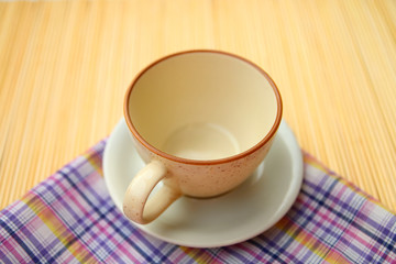 empty coffee cup on linen